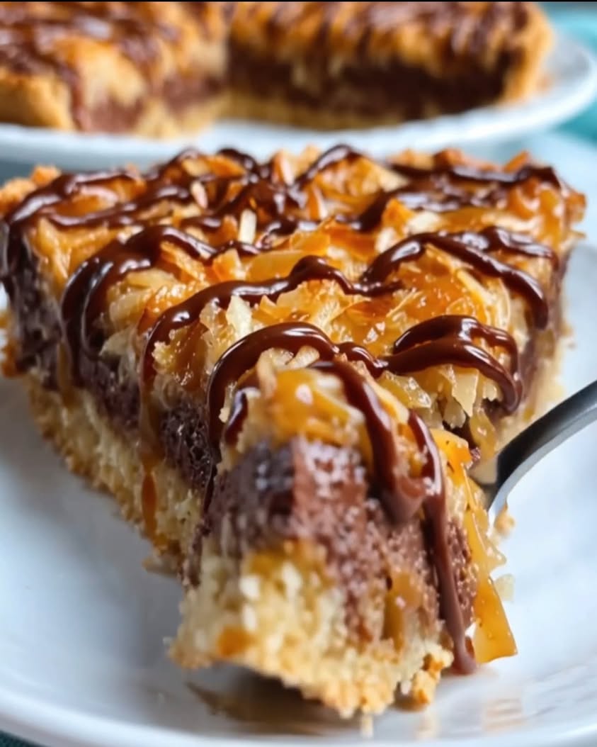 All the Samoa cookie vibes in one warm gooey pie—buttery crust melty chocolate toasted coconut and a thick caramel l