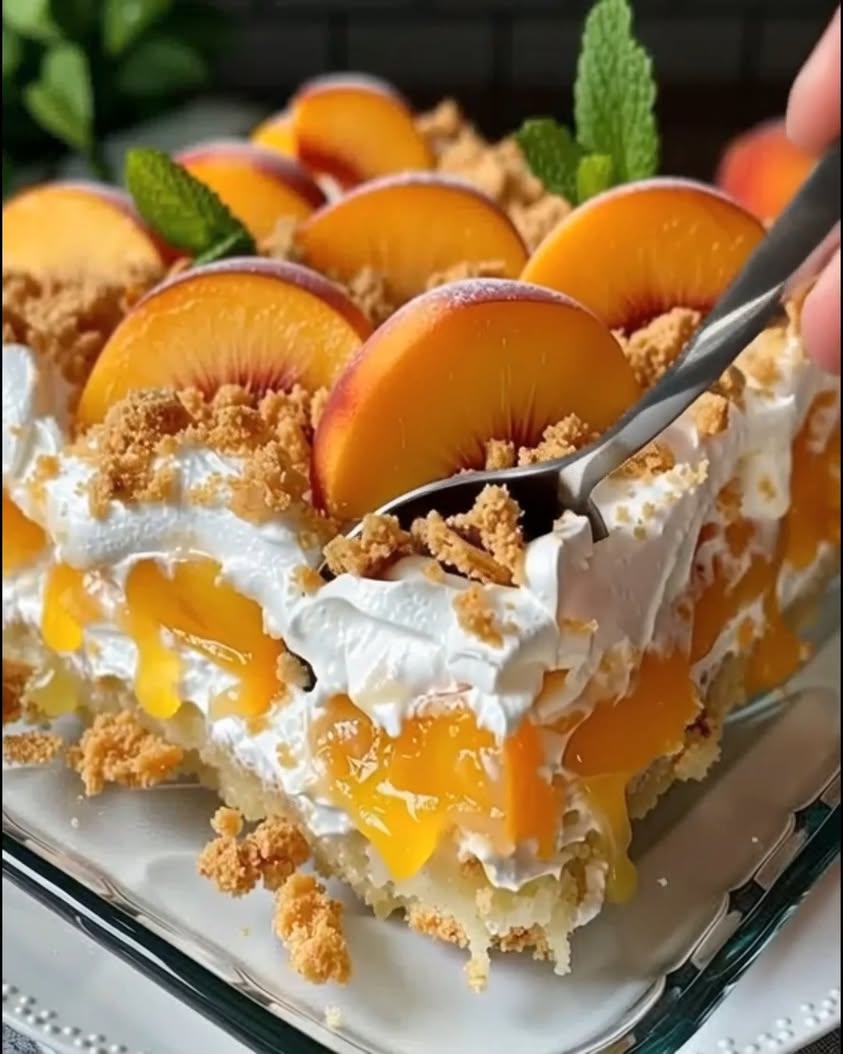 Moist cake soaked with juicy peaches topped with a buttery cobbler style crumble—sweet cozy and perfect for potlucks